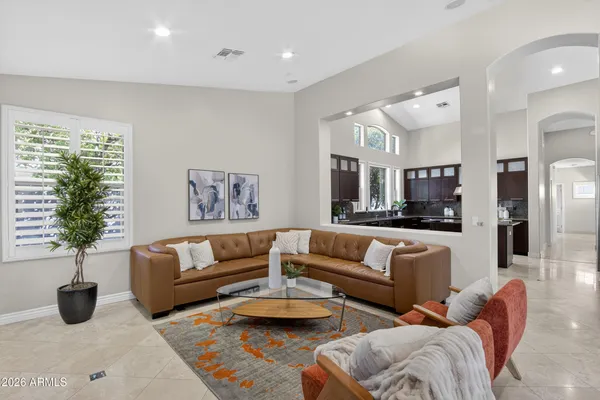 a living room with furniture potted plant and a window
