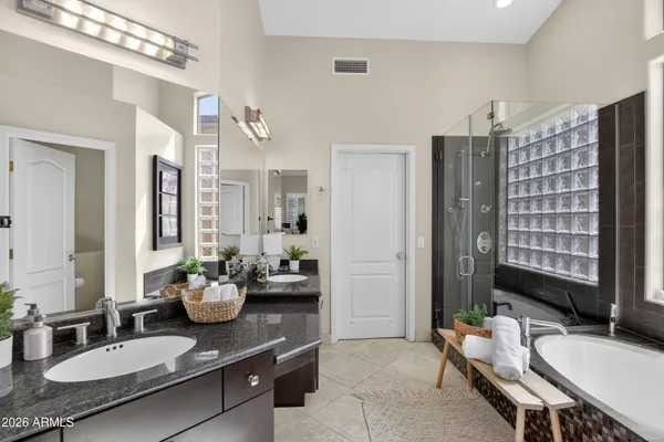 a bathroom with a shower and a mirror