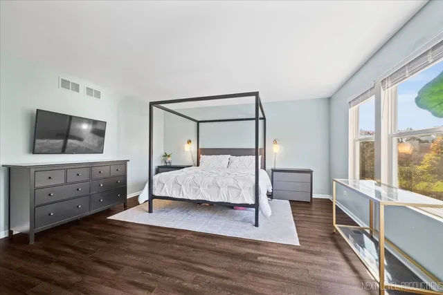 a bedroom with a bed and a dresser