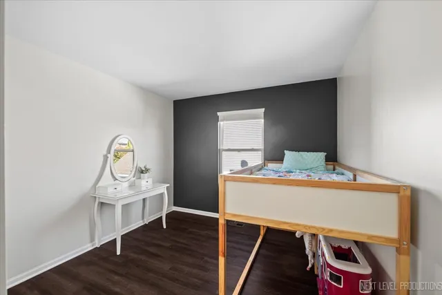 a bathroom with a sink toilet and a mirror