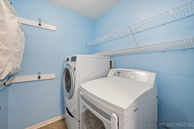 a view of backyard of house with wooden deck and seating