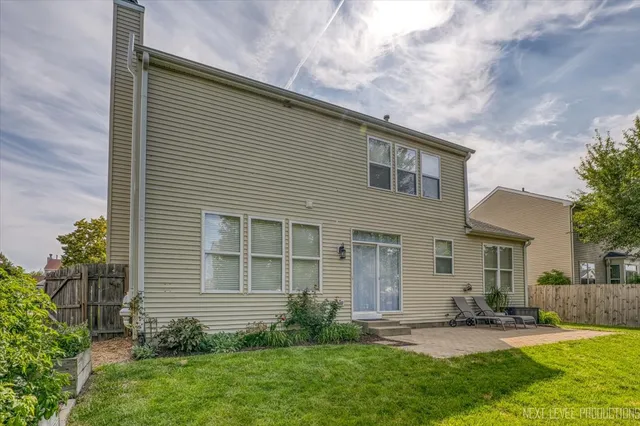 a view of a patio with couches chairs and potted plants