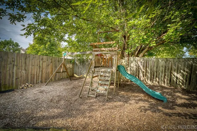 a view of a swimming pool with an outdoor seating