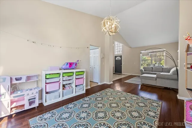 a kitchen with stainless steel appliances granite countertop a stove a sink a microwave and a refrigerator