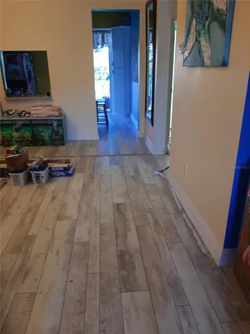 a view of livingroom with furniture and flat screen tv