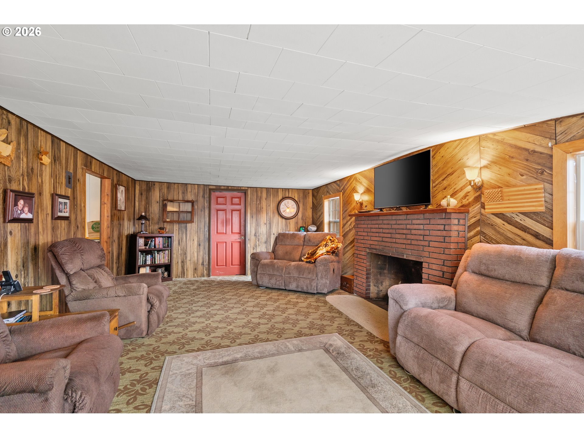 51982 Sunflower Flat Road Heppner, OR 97836 - Photo 6 of 44 a living room with furniture and a fireplace