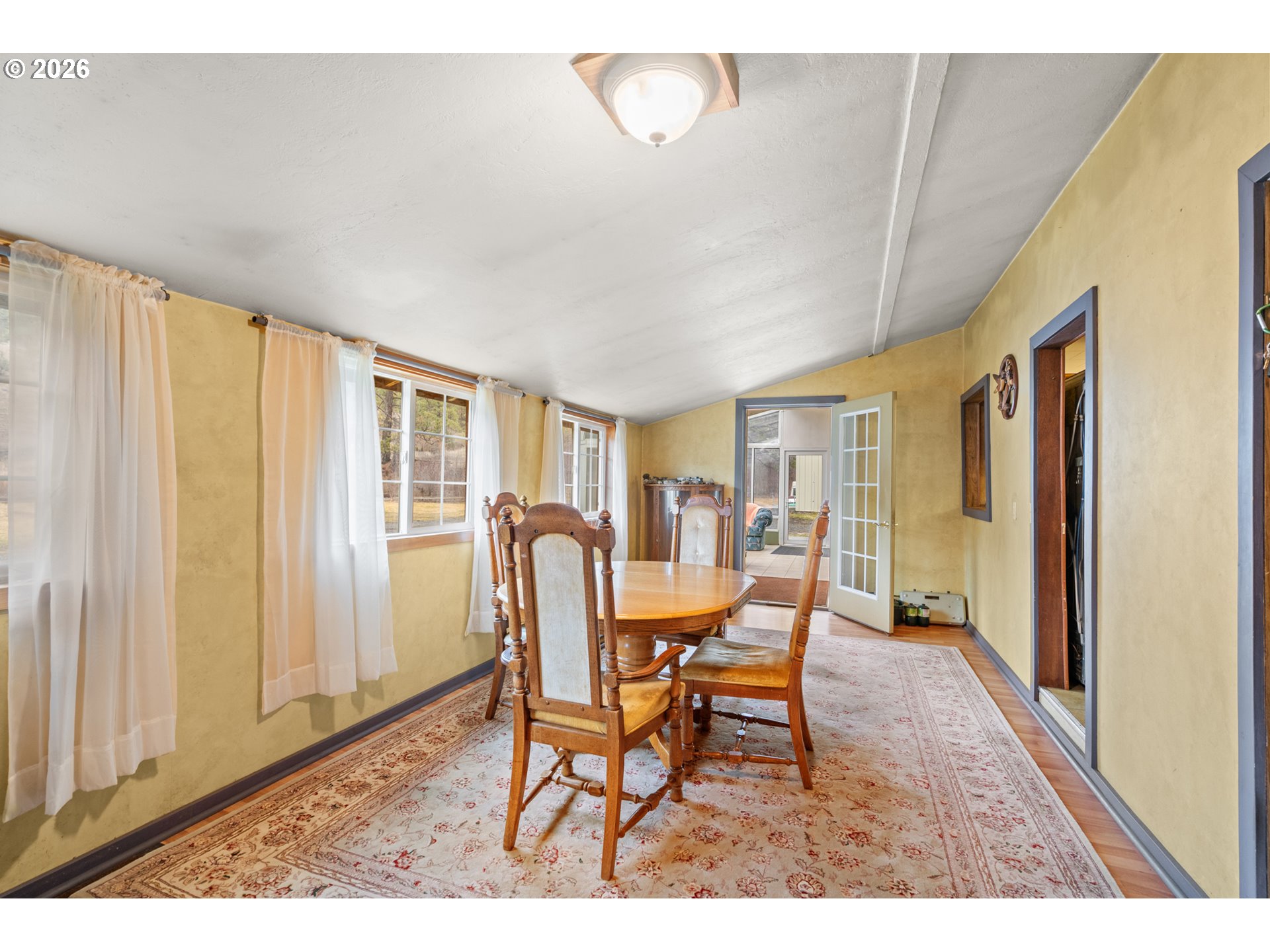 51982 Sunflower Flat Road Heppner, OR 97836 - Photo 8 of 44 a view of a dining room with furniture and a window
