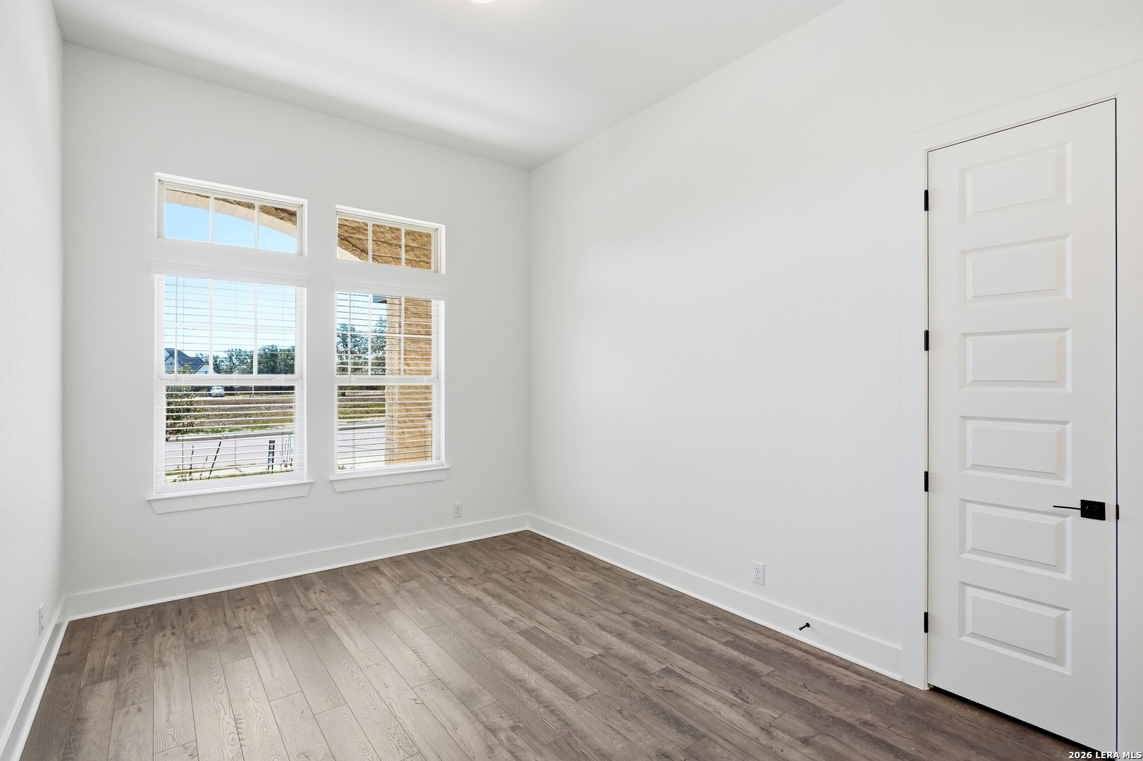 513 Corwin Springs Cibolo, TX 78108 - Photo 13 of 40 an empty room with wooden floor and window