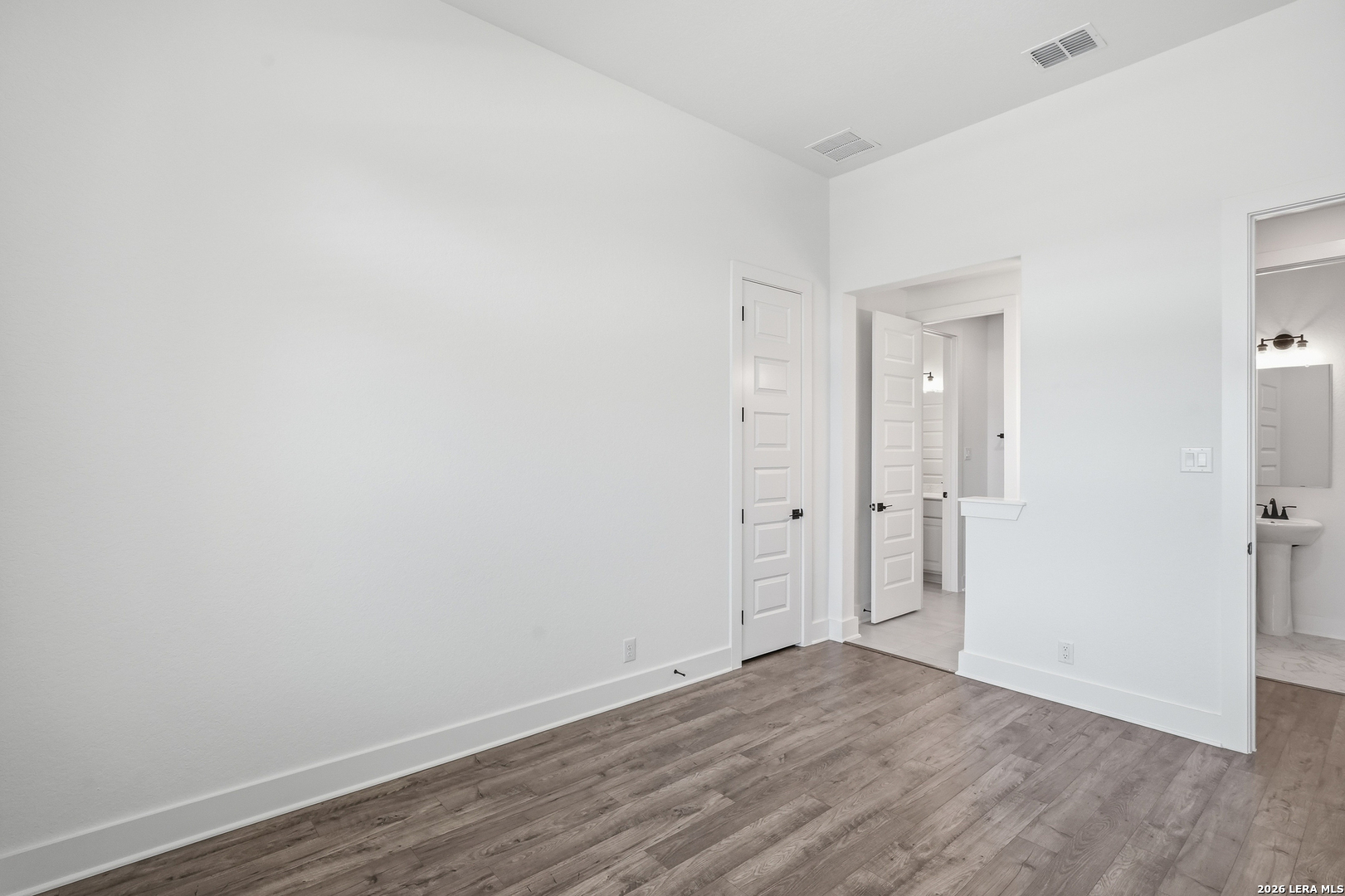 513 Corwin Springs Cibolo, TX 78108 - Photo 14 of 40 a view of an empty room with wooden floor