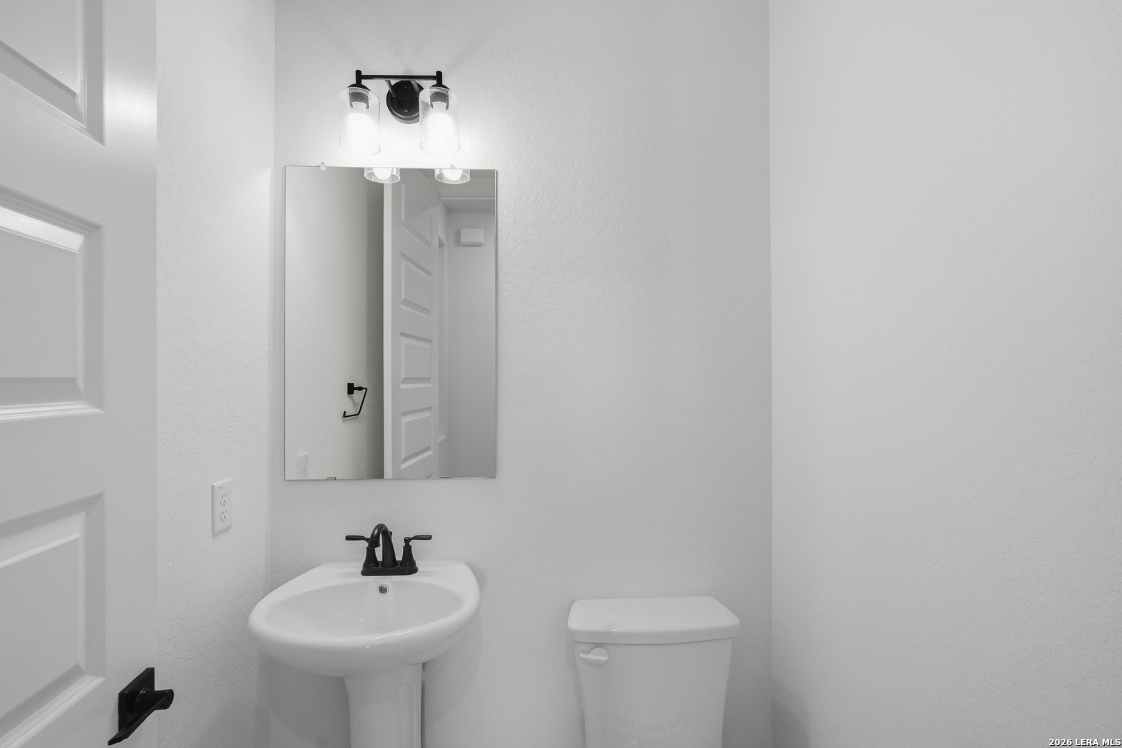 513 Corwin Springs Cibolo, TX 78108 - Photo 16 of 40 a bathroom with a sink and mirror