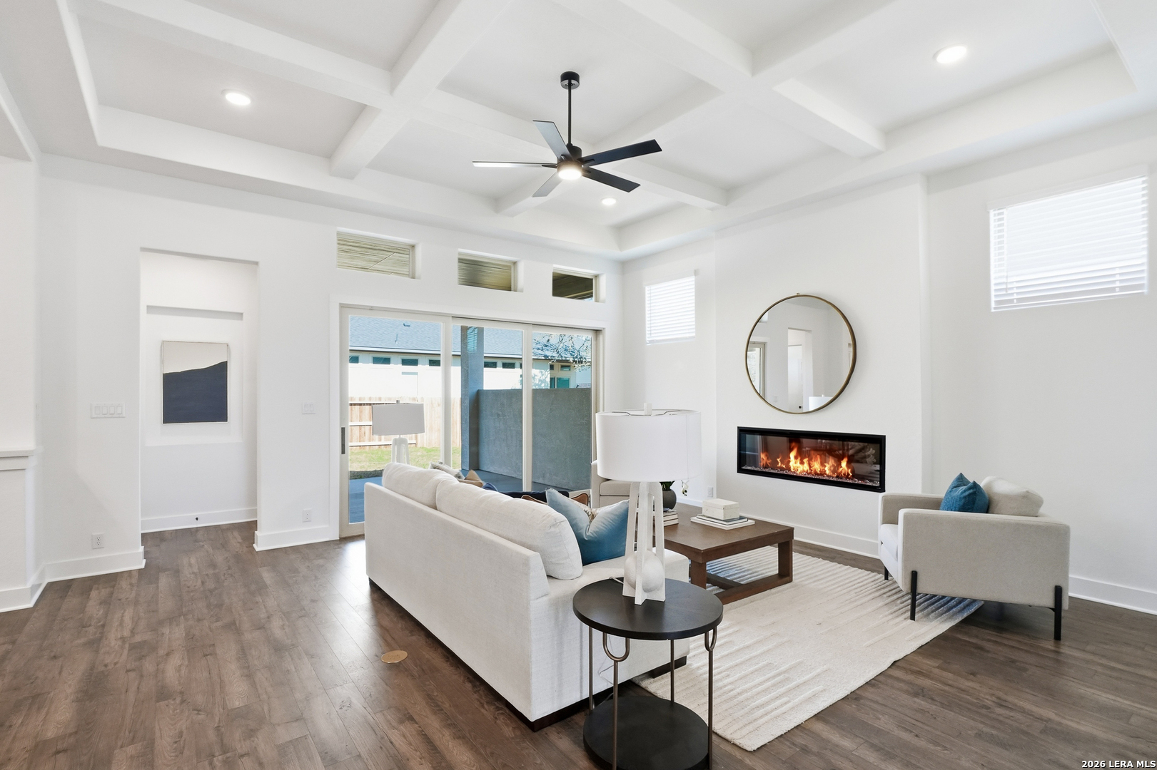 513 Corwin Springs Cibolo, TX 78108 - Photo 17 of 40 a living room with fireplace furniture and a wooden floor