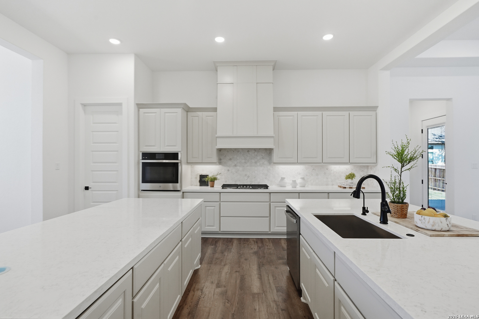 513 Corwin Springs Cibolo, TX 78108 - Photo 25 of 40 a kitchen with granite countertop a sink stove and refrigerator