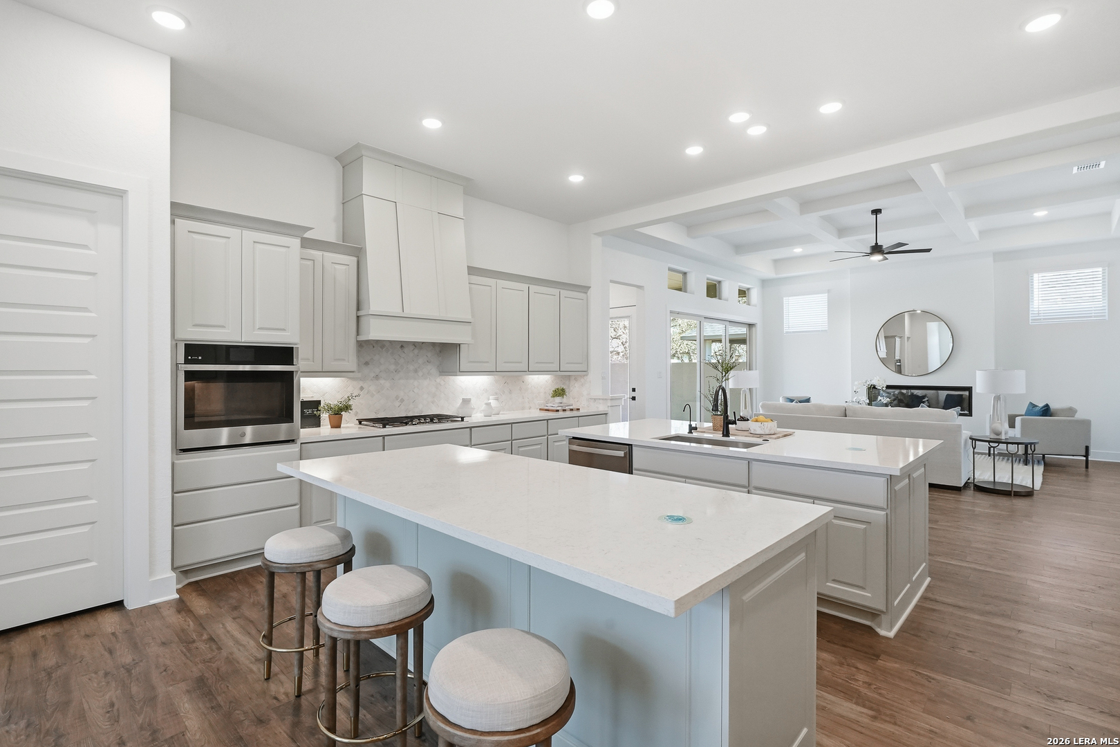513 Corwin Springs Cibolo, TX 78108 - Photo 26 of 40 a kitchen with a sink a stove and chairs