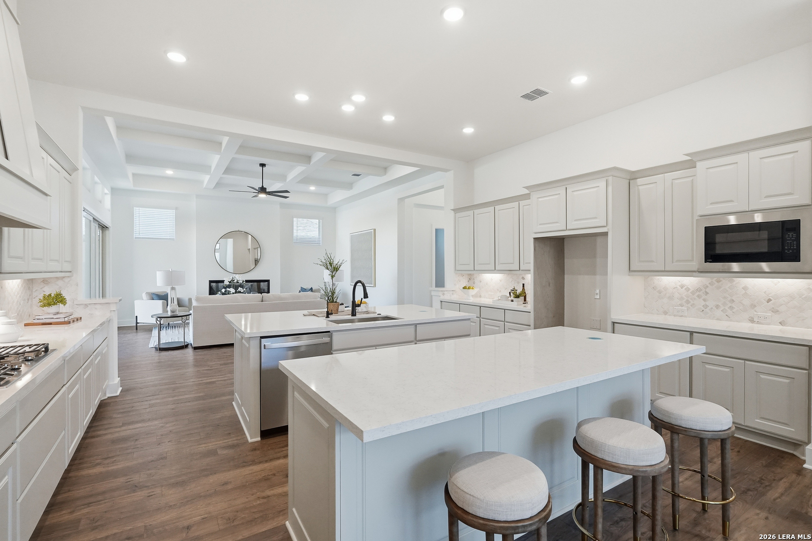 513 Corwin Springs Cibolo, TX 78108 - Photo 27 of 40 a kitchen with a table chairs sink and microwave