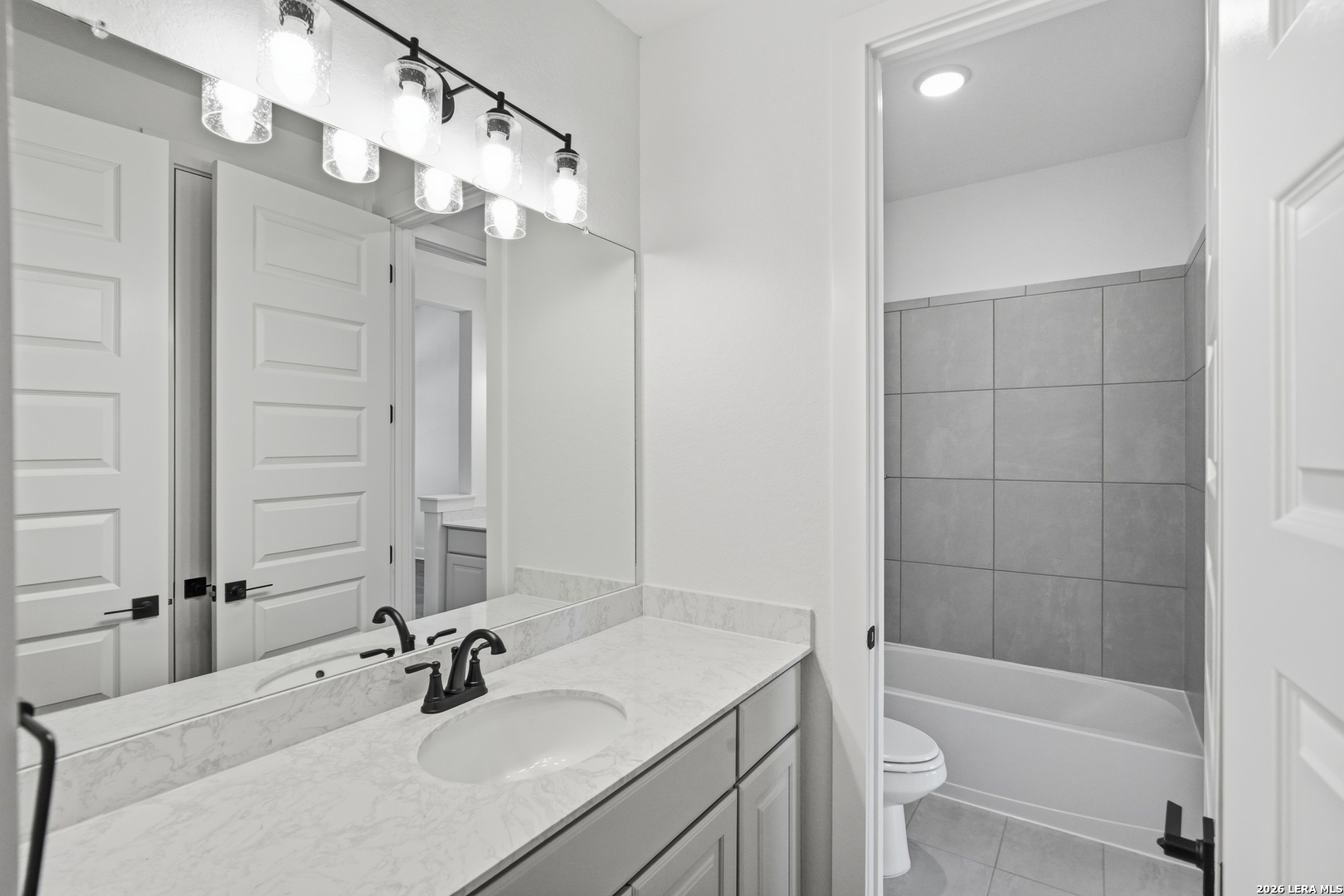 513 Corwin Springs Cibolo, TX 78108 - Photo 29 of 40 a bathroom with a sink a toilet and shower