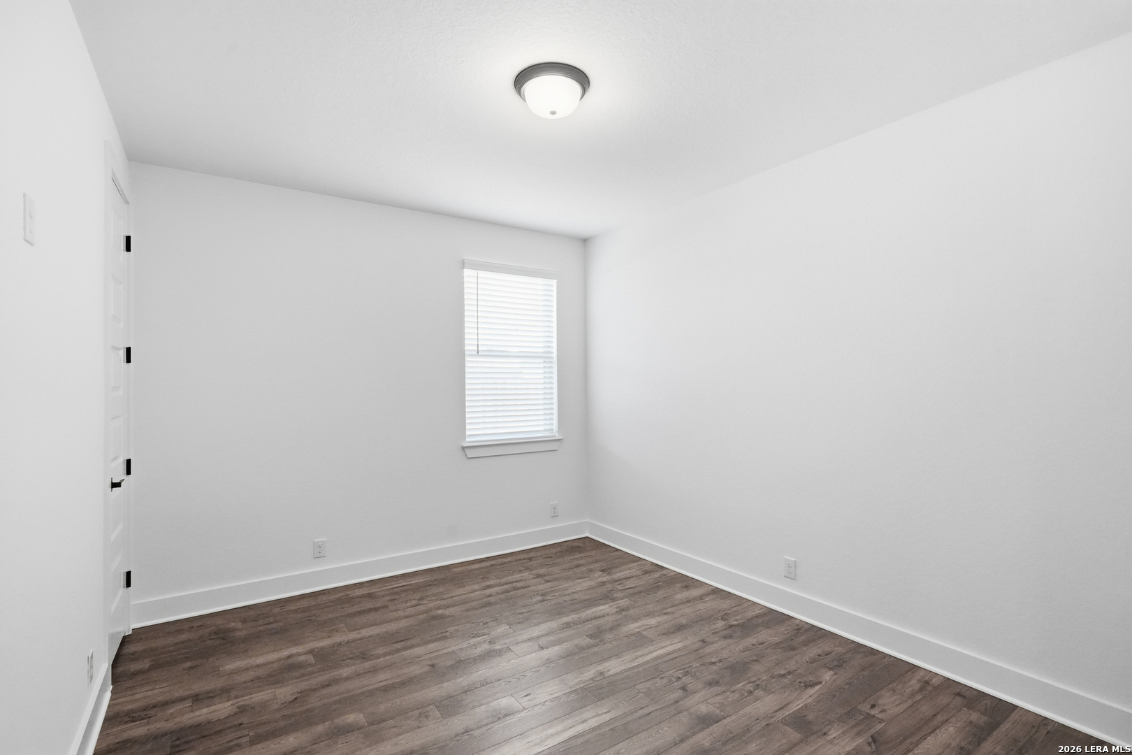513 Corwin Springs Cibolo, TX 78108 - Photo 30 of 40 an empty room with wooden floor and windows