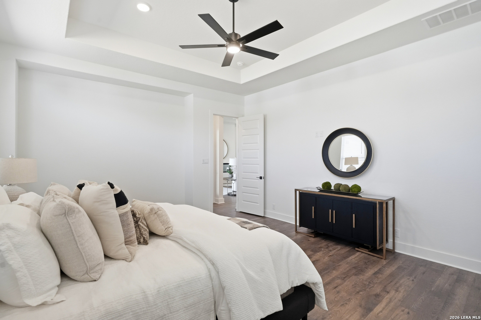 513 Corwin Springs Cibolo, TX 78108 - Photo 33 of 40 a bedroom with bed and a chandelier