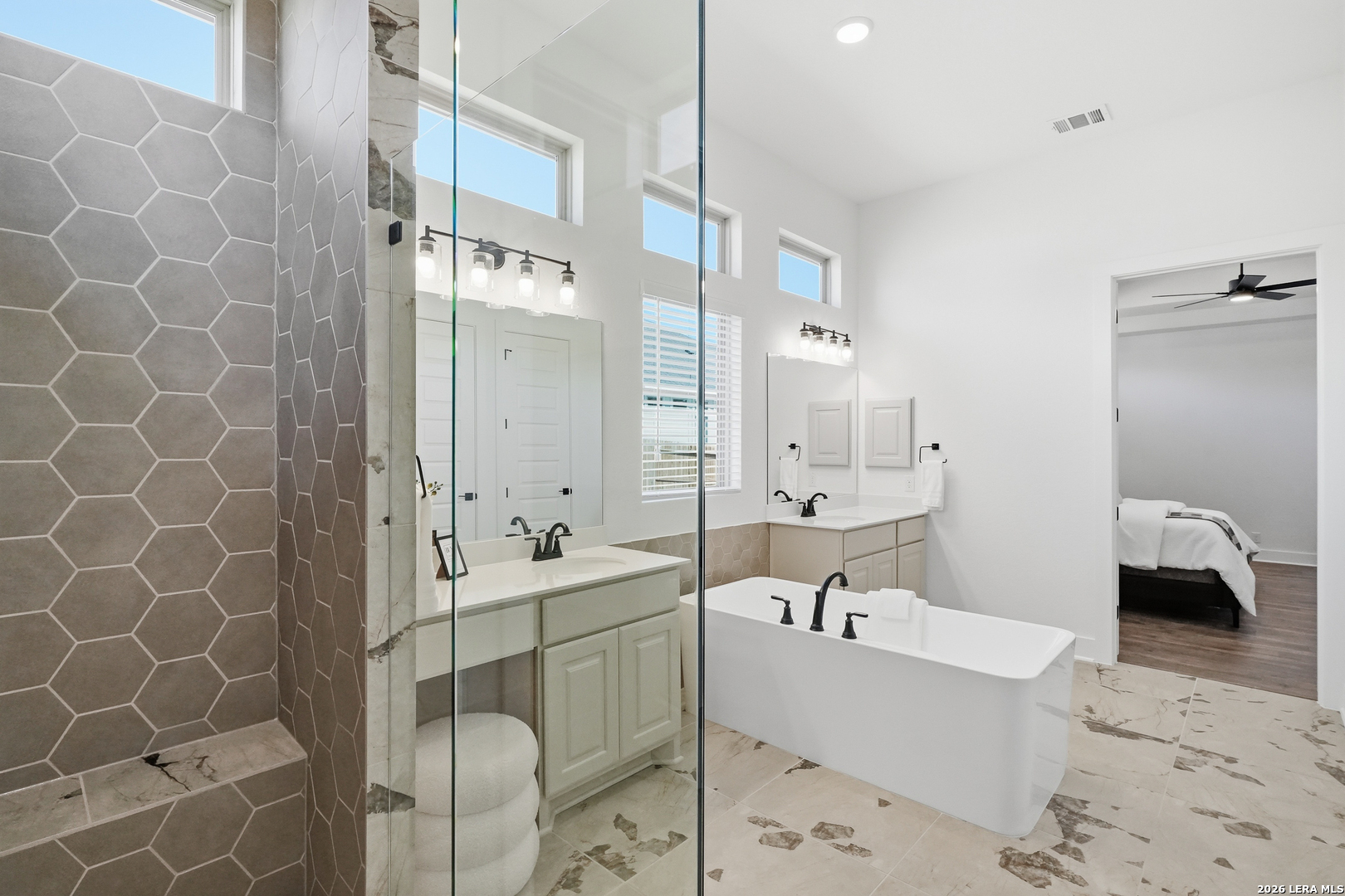 513 Corwin Springs Cibolo, TX 78108 - Photo 35 of 40 a bathroom with a tub a sink and mirror