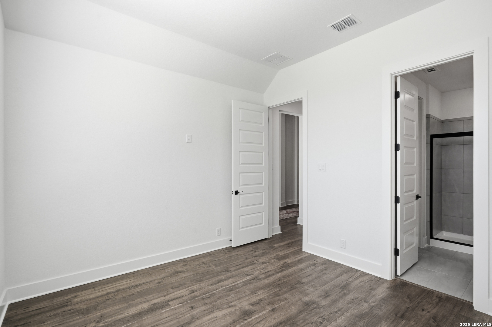 513 Corwin Springs Cibolo, TX 78108 - Photo 9 of 40 an empty room with wooden floor & closet area