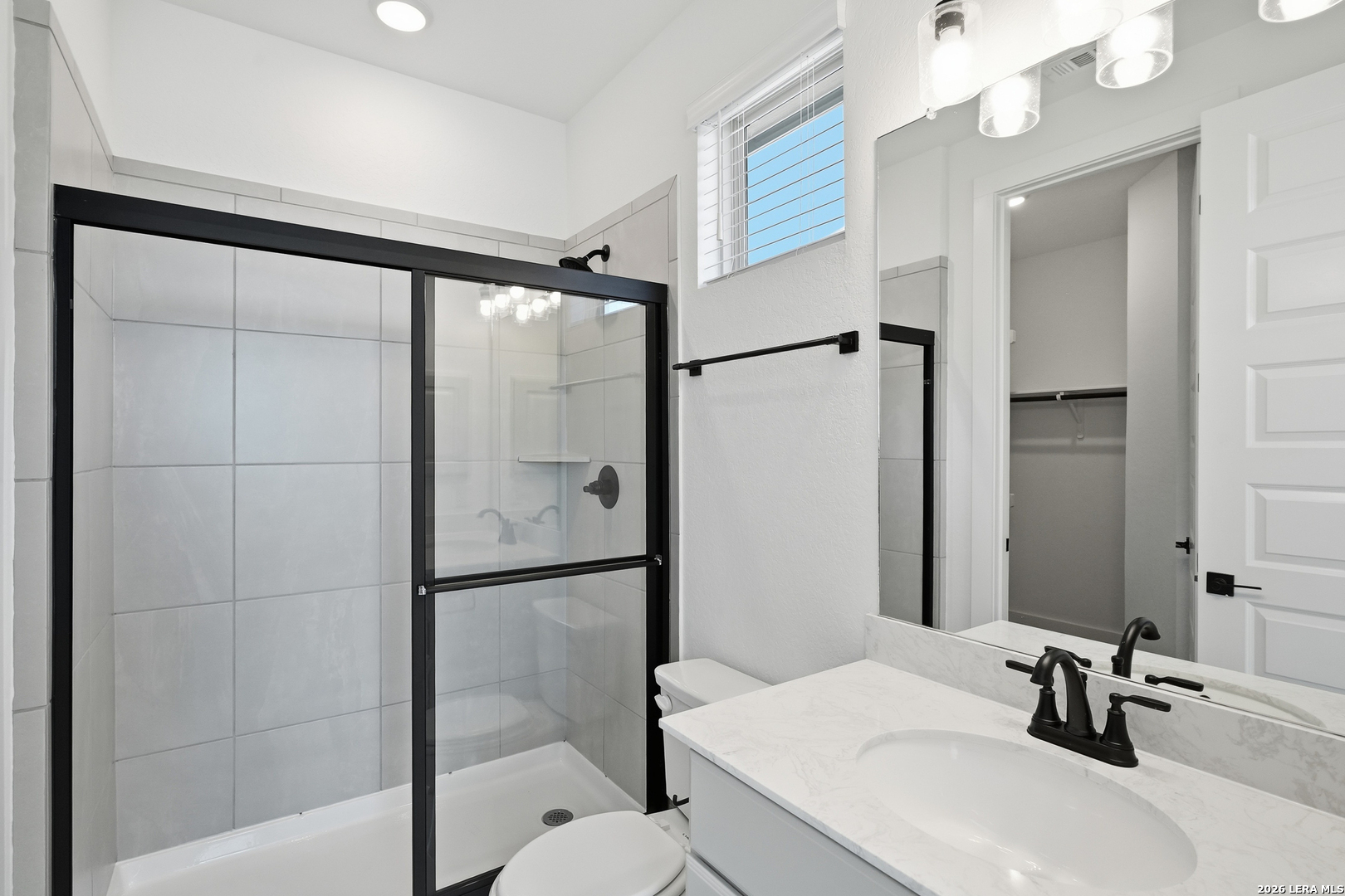 513 Corwin Springs Cibolo, TX 78108 - Photo 10 of 40 a bathroom with a sink and a mirror