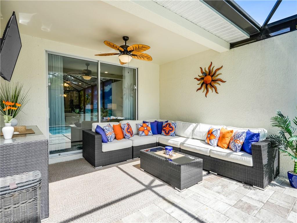14695 Edgewater Circle Naples, FL 34114 - Photo 23 of 39 a outdoor living space with furniture and a couch