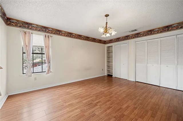 a view of livingroom with hardwood floor ceiling fan and window