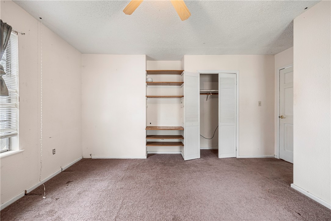 3087 Lenore Avenue Ingleside, TX 78362 - Photo 5 of 29 a view of an empty room with a kitchen