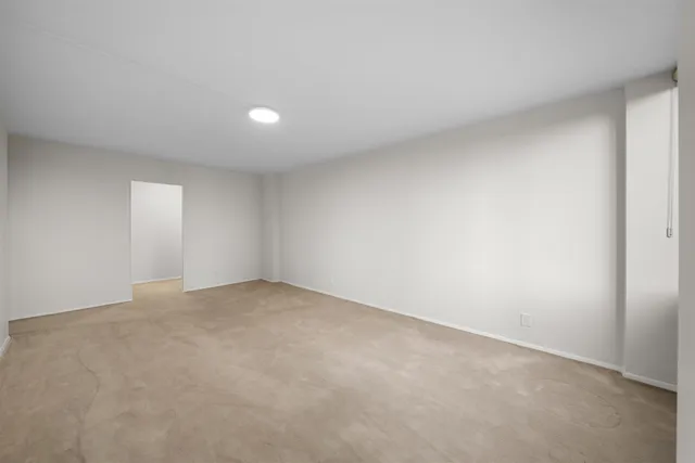 a view of an empty room and window