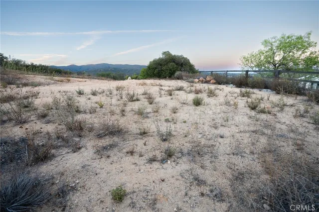 a view of a pathway with a lake