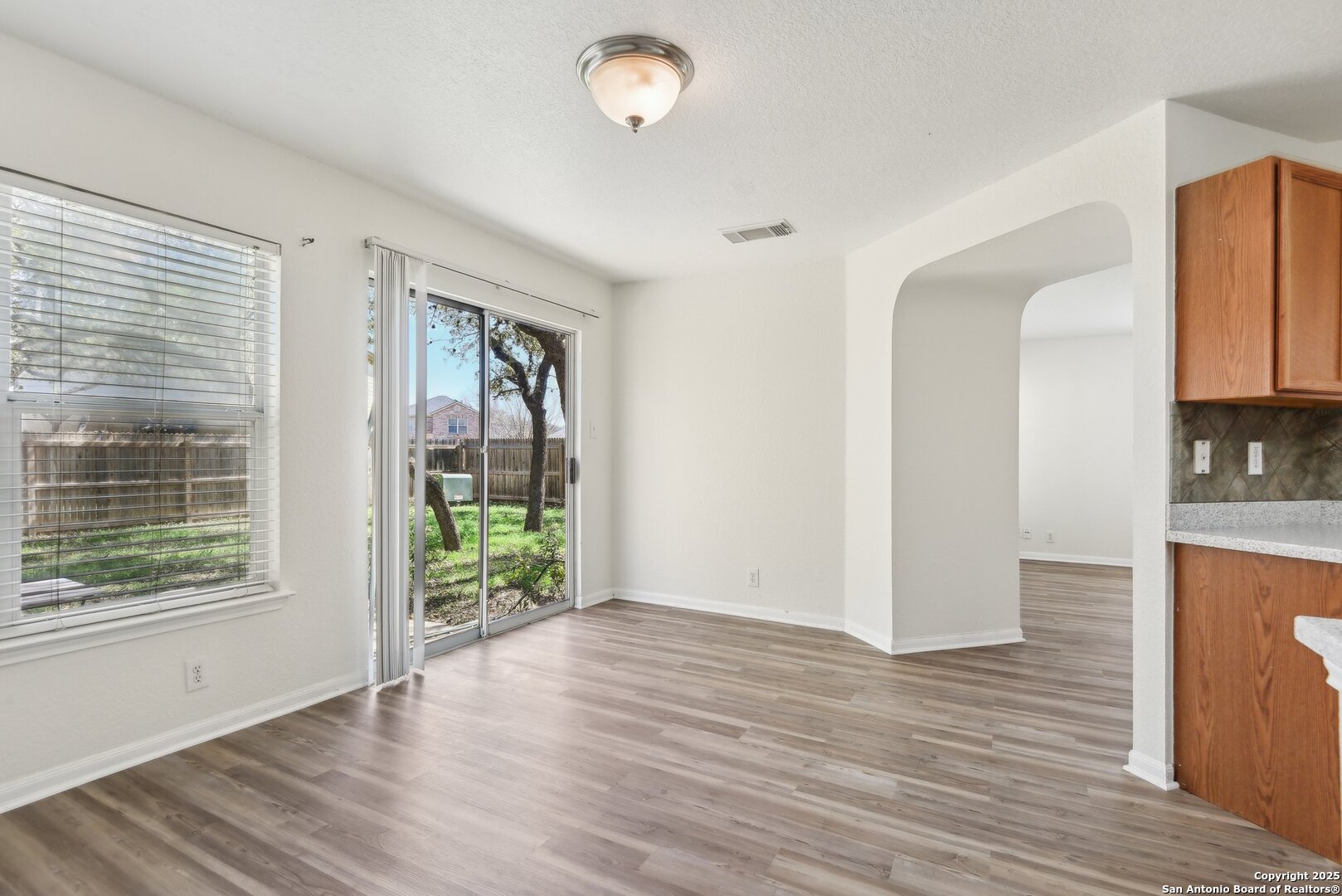 16216 Ike Lane Selma, TX 78154 - Photo 12 of 40 a view of hallway with wooden floor and fan