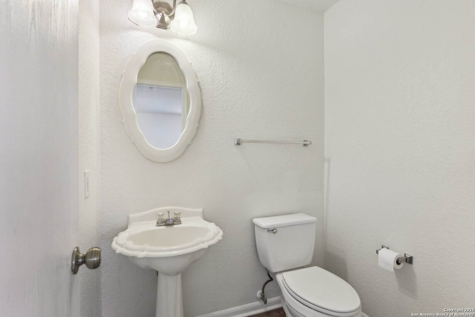 16216 Ike Lane Selma, TX 78154 - Photo 15 of 40 a bathroom with a toilet sink and mirror