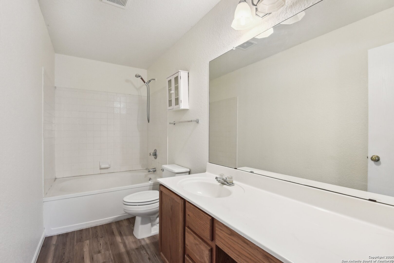 16216 Ike Lane Selma, TX 78154 - Photo 25 of 40 a bathroom with a sink a toilet and shower