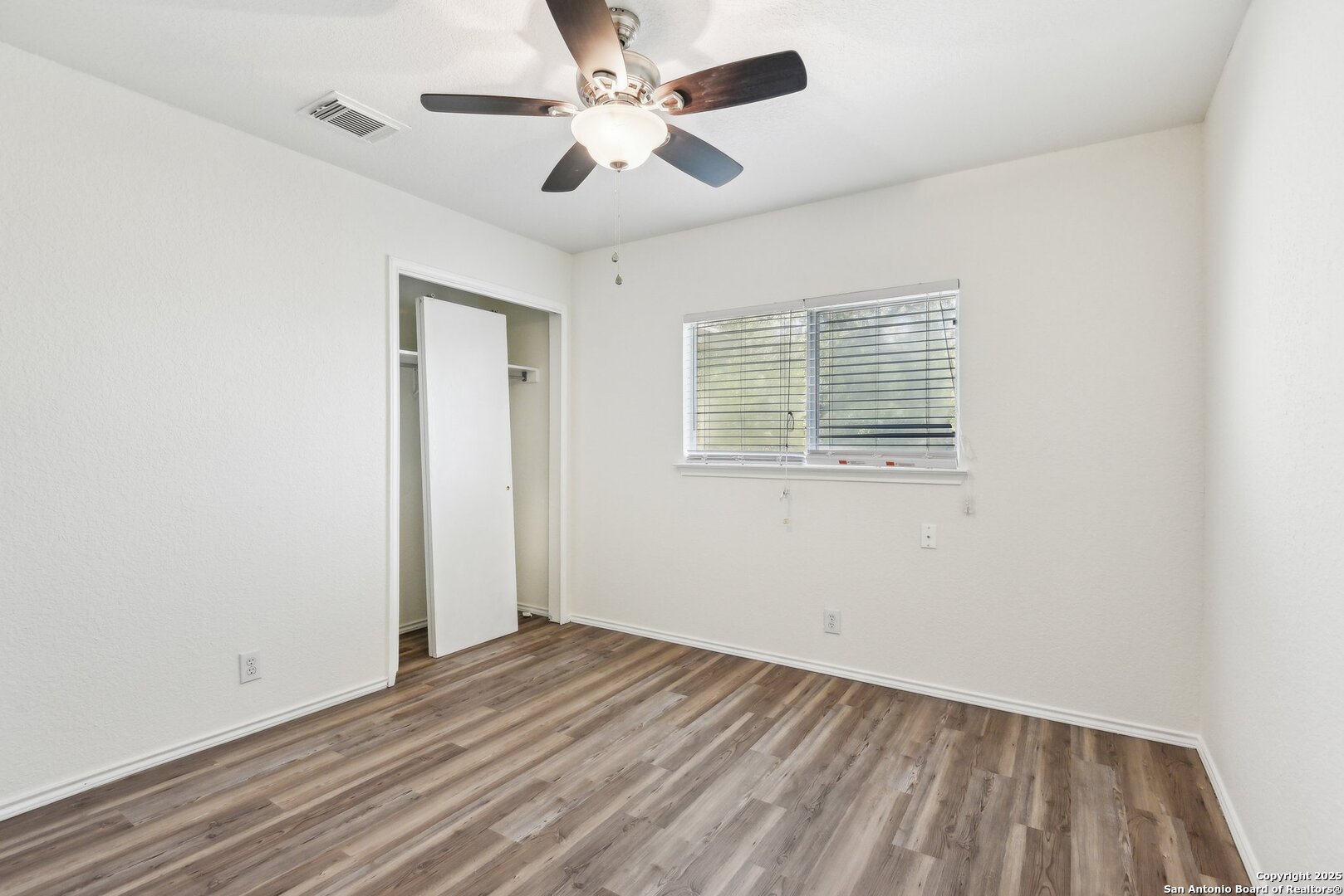 16216 Ike Lane Selma, TX 78154 - Photo 27 of 40 an empty room with a window and a ceiling fan