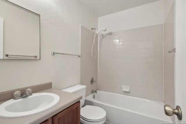 a bathroom with a sink toilet and a bathtub
