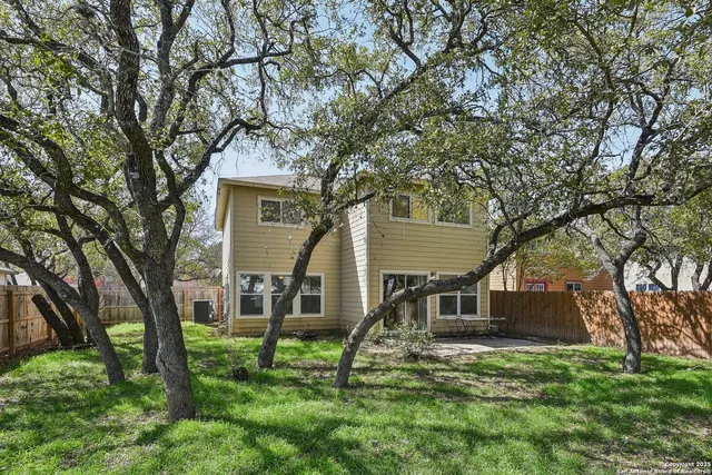 a house that has tree in front of it