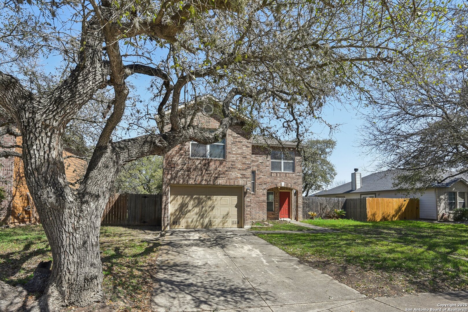 16216 Ike Lane Selma, TX 78154 - Photo 37 of 40 a front view of a house with a yard and a garage