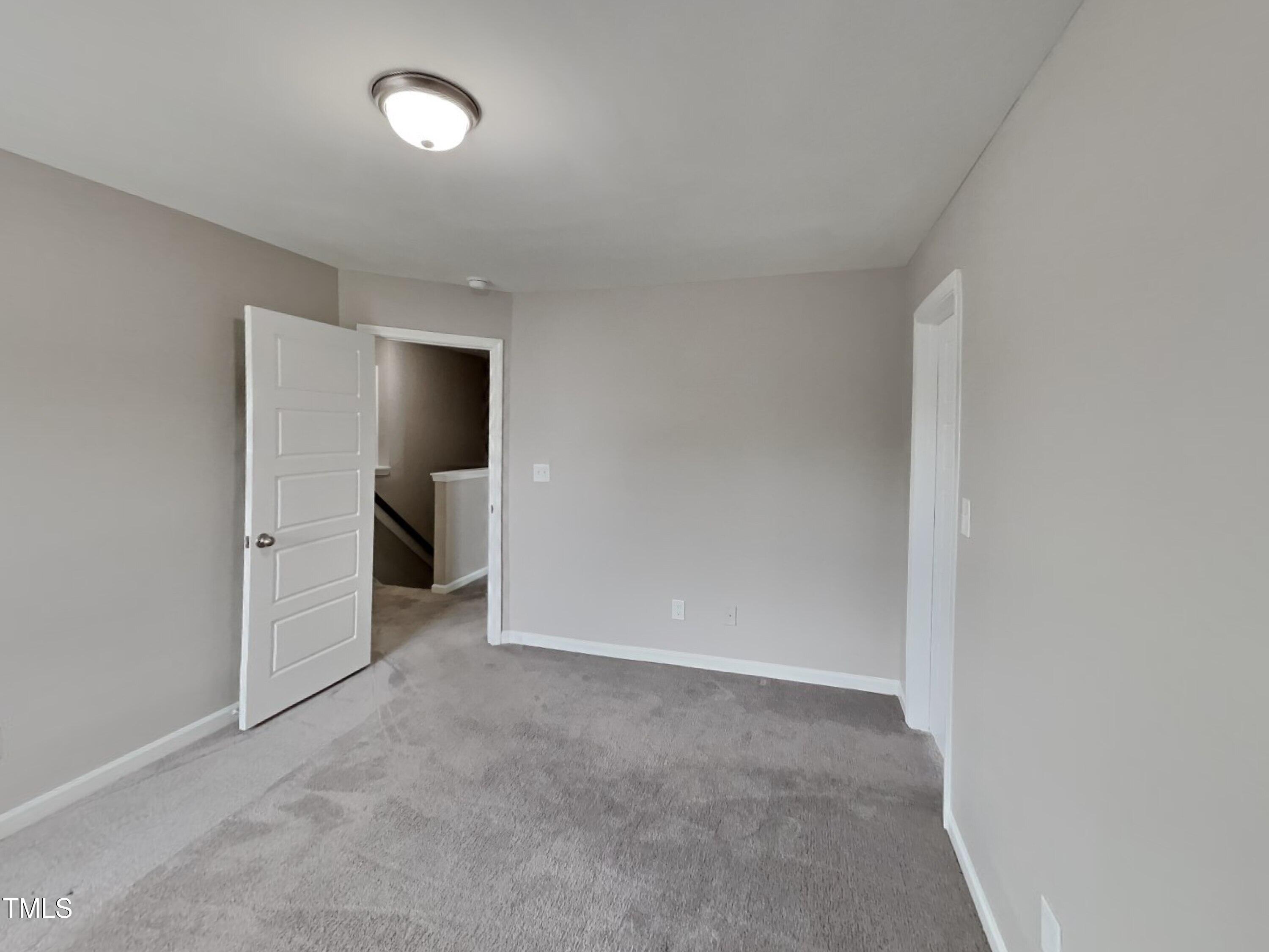 67 Weathervane Dr. Zebulon, NC 27597 - Photo 12 of 17 an empty room with a bathroom and toilet
