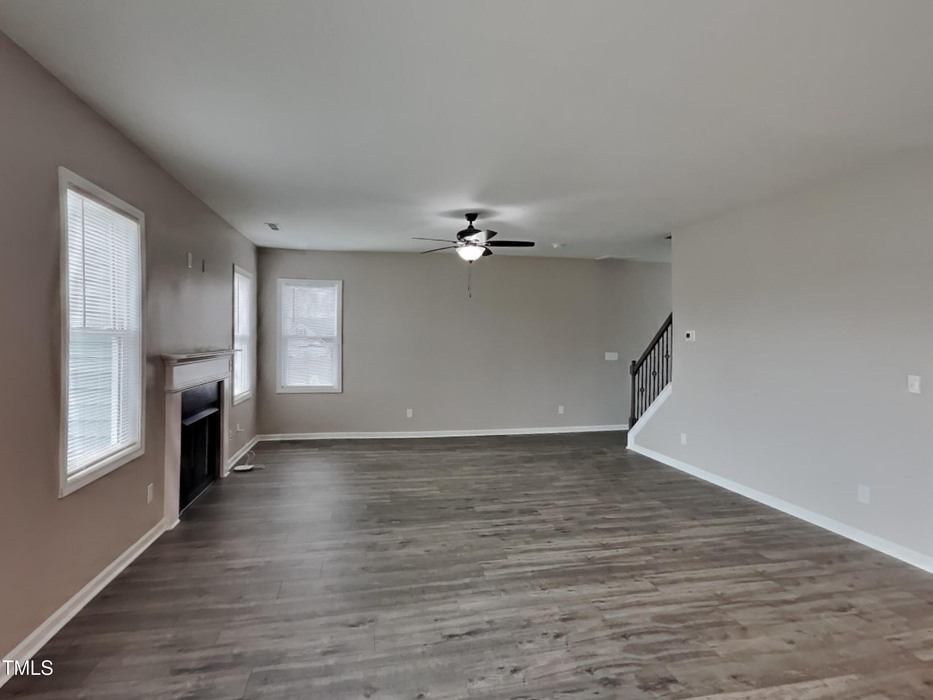 67 Weathervane Dr. Zebulon, NC 27597 - Photo 2 of 17 wooden floor in an empty room with a window