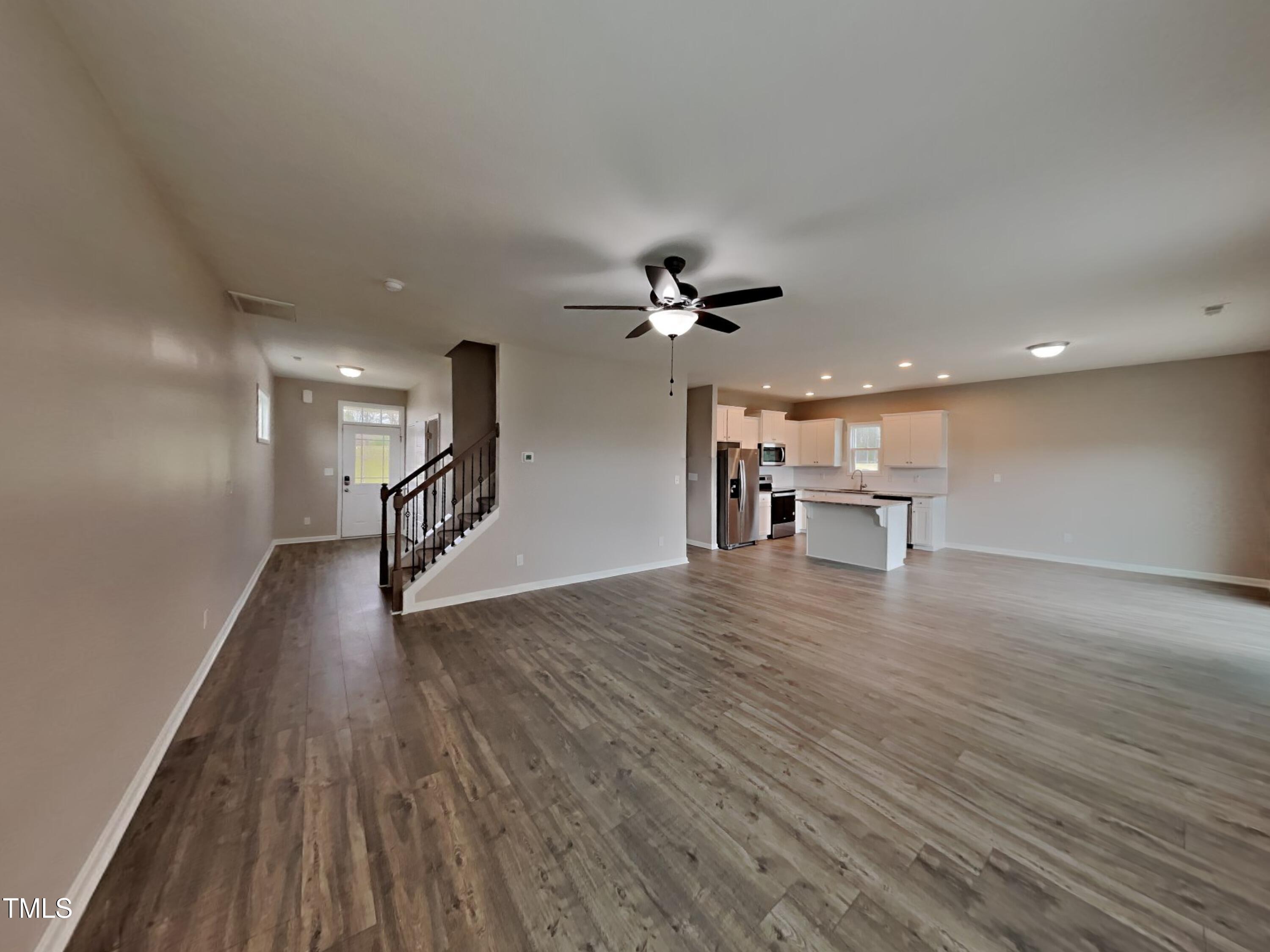 67 Weathervane Dr. Zebulon, NC 27597 - Photo 3 of 17 a view of empty room with wooden floor