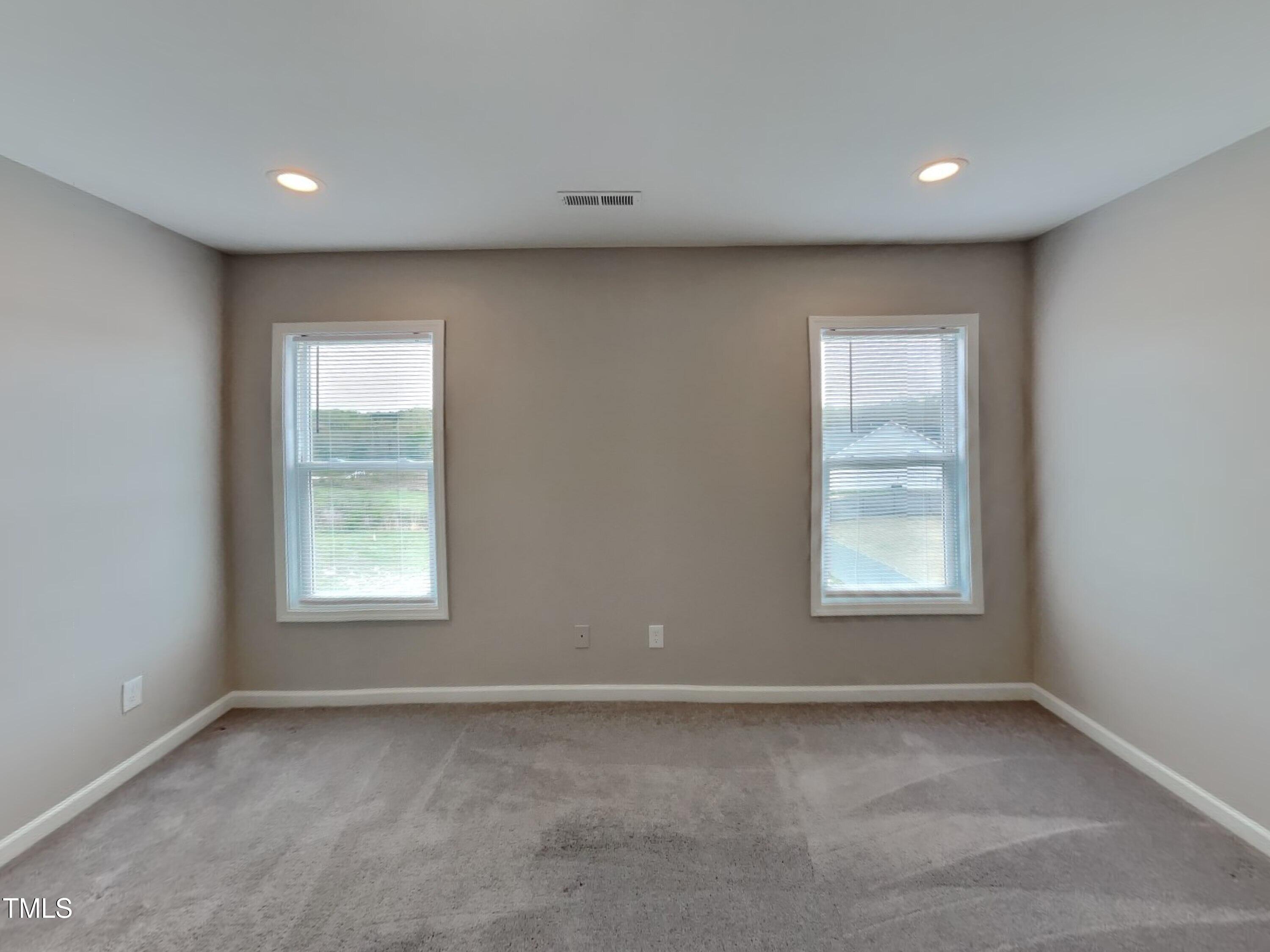67 Weathervane Dr. Zebulon, NC 27597 - Photo 7 of 17 an empty room with a window