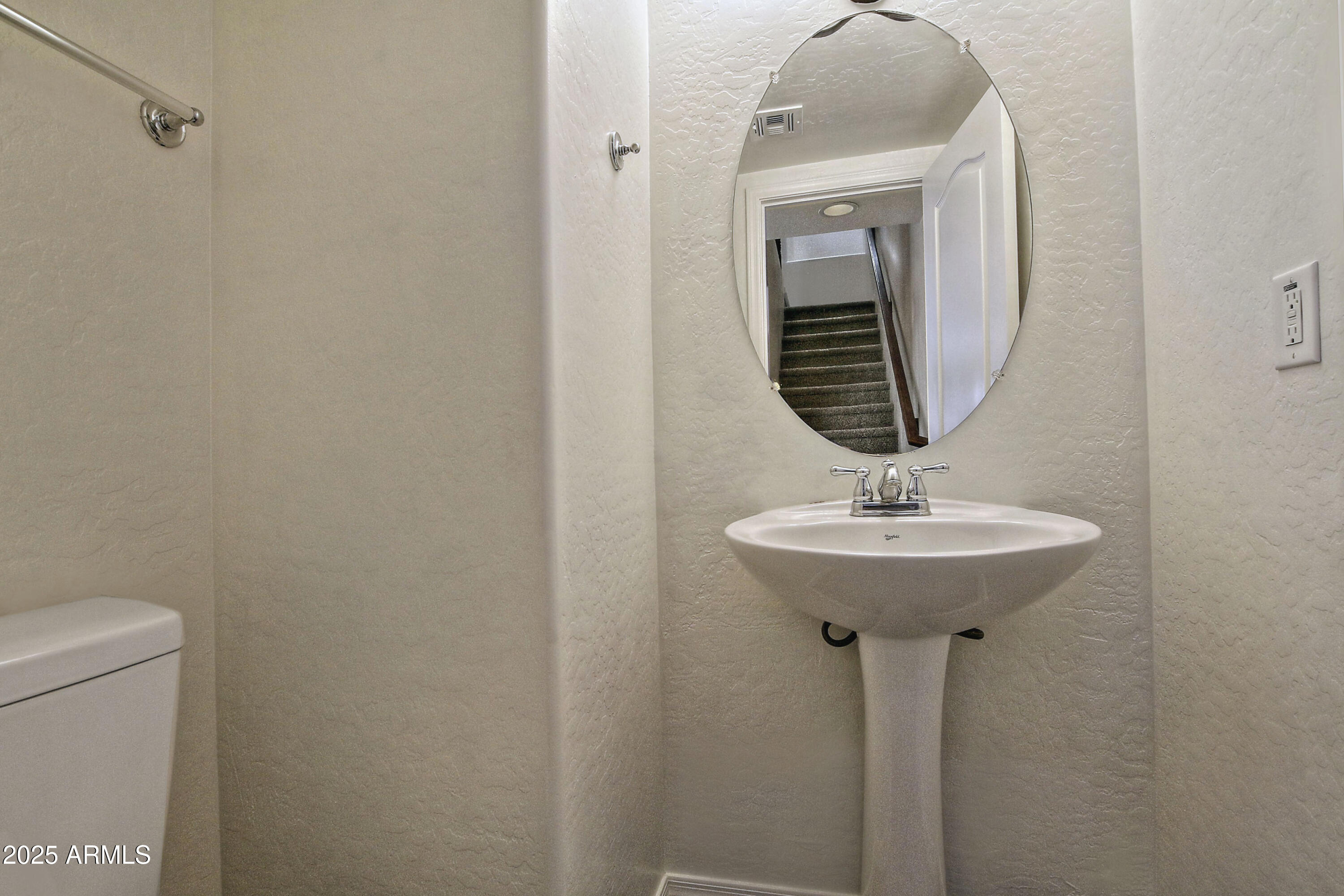 2785 South Alpine Drive Gilbert, AZ 85295 - Photo 16 of 31 a bathroom with a sink and mirror