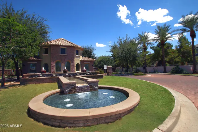 a view of a house with swimming pool and sitting area