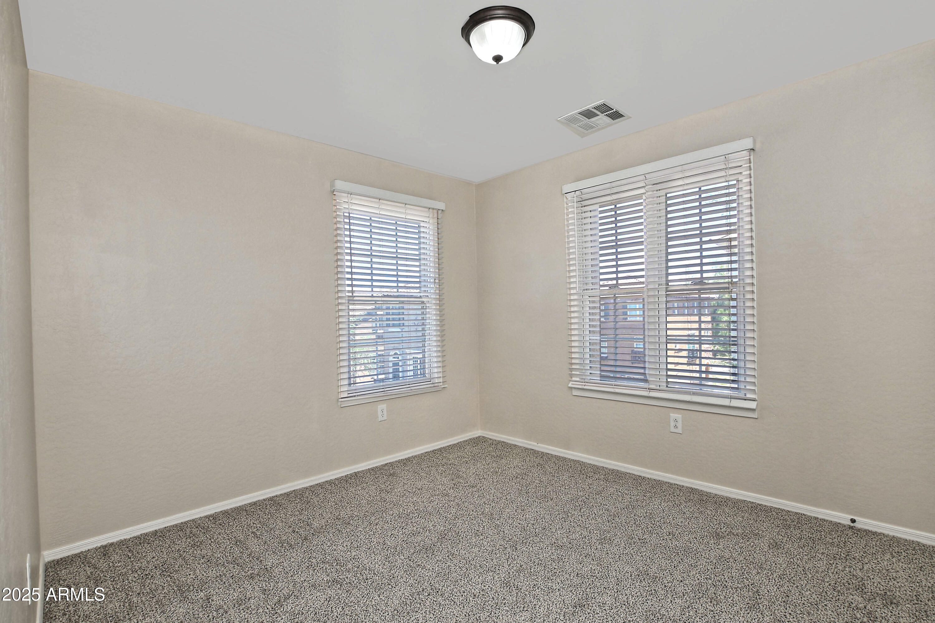 2785 South Alpine Drive Gilbert, AZ 85295 - Photo 24 of 31 an empty room with windows