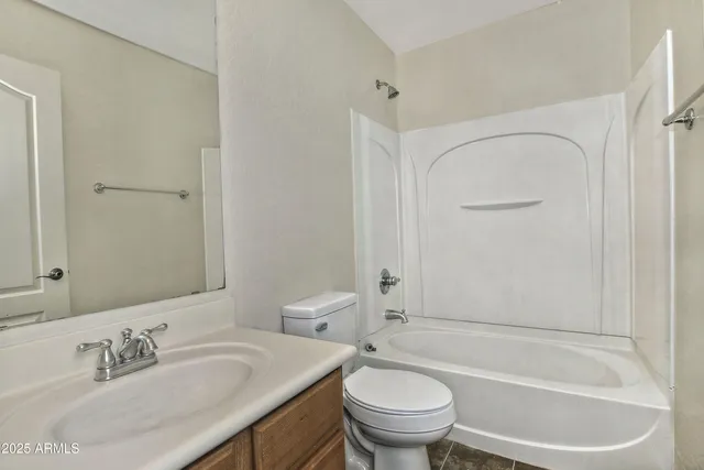 an aerial view of house with a yard