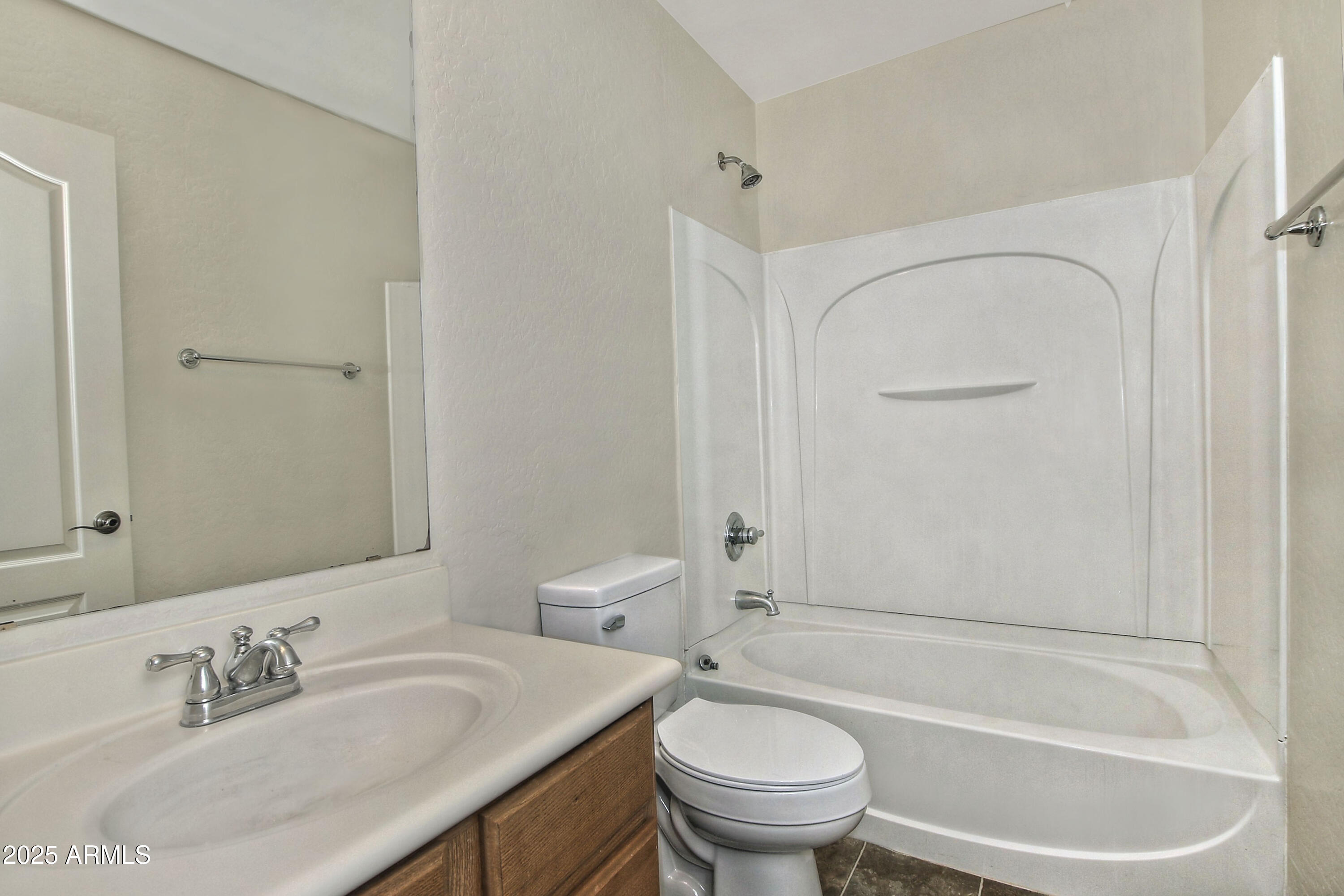 2785 South Alpine Drive Gilbert, AZ 85295 - Photo 26 of 31 a bathroom with a sink toilet and shower
