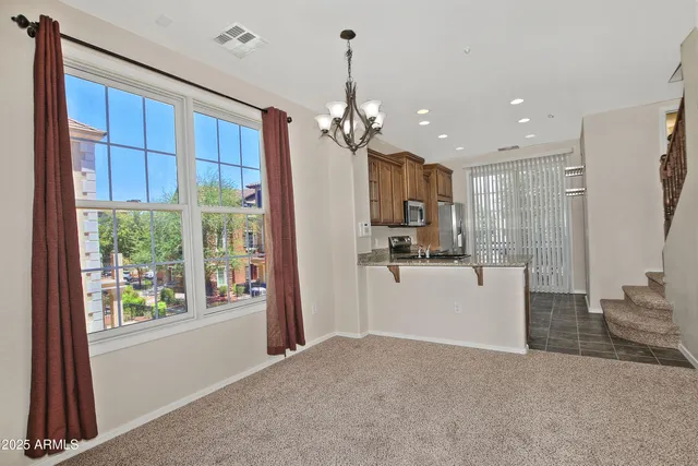 a view of a kitchen with a sink and a window