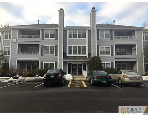 101 Raintree Court Helmetta, NJ 08828 - Photo 1 of 9 a couple of cars parked in front of a building