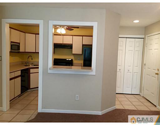 101 Raintree Court Helmetta, NJ 08828 - Photo 3 of 9 a view of kitchen with a sink cabinets and a window