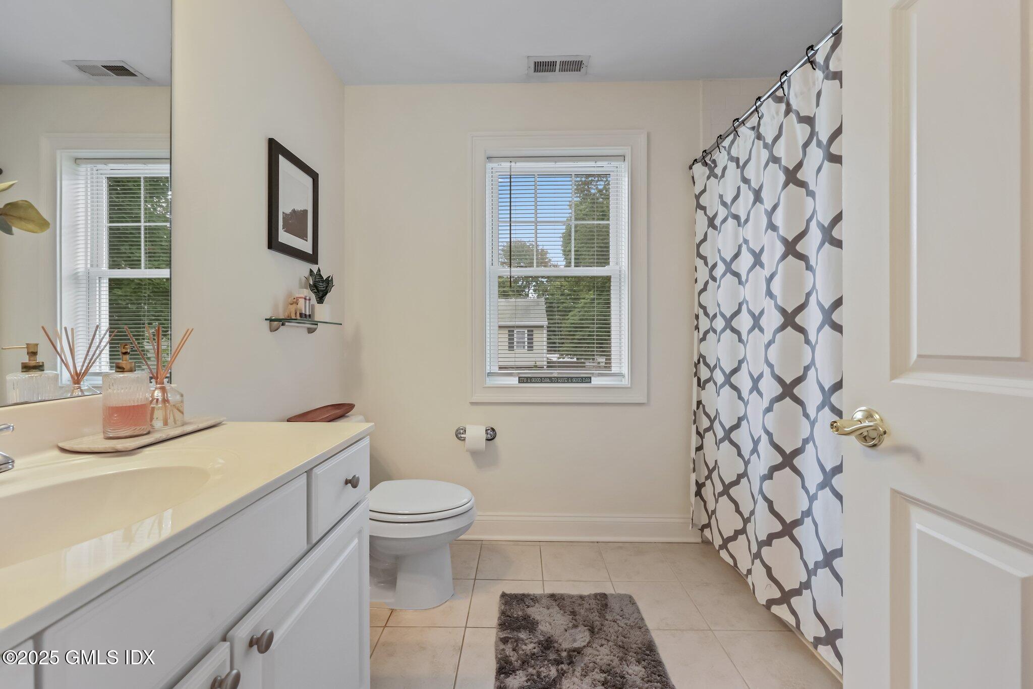 39 Maple Tree Avenue, Unit 16 Stamford, CT 06906 - Photo 13 of 21 a bathroom with a sink toilet and shower