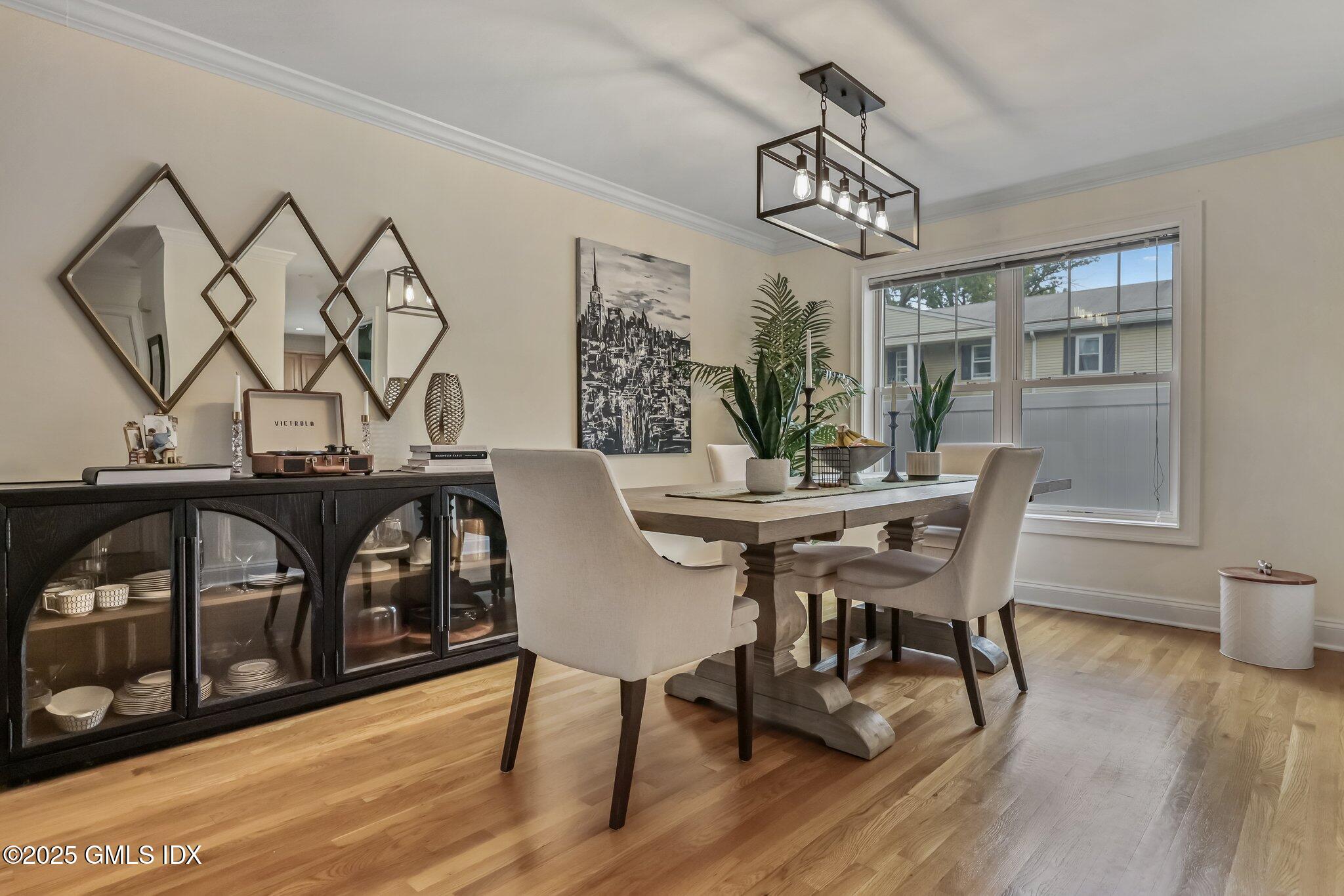 39 Maple Tree Avenue, Unit 16 Stamford, CT 06906 - Photo 3 of 21 a view of a dining room with furniture window and wooden floor